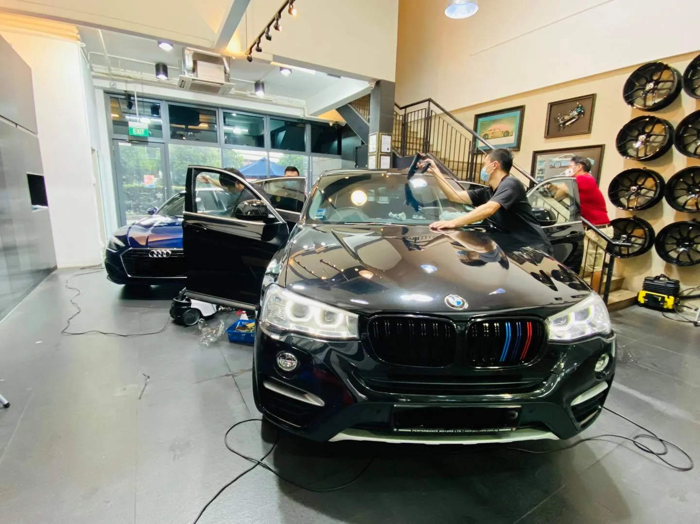 Black BMW coupe SUV having window film applied at Infratint Singapore