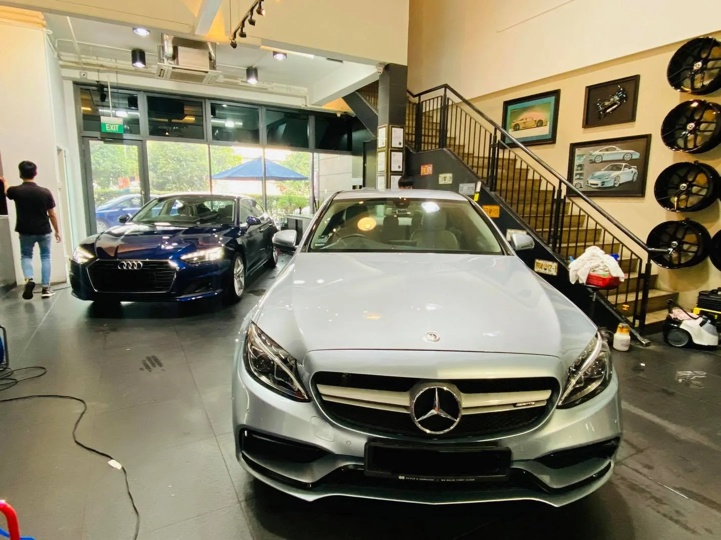 Silver Mercedes-Benz C-Class and blue Audi A5 at Infratint Singapore for window tinting