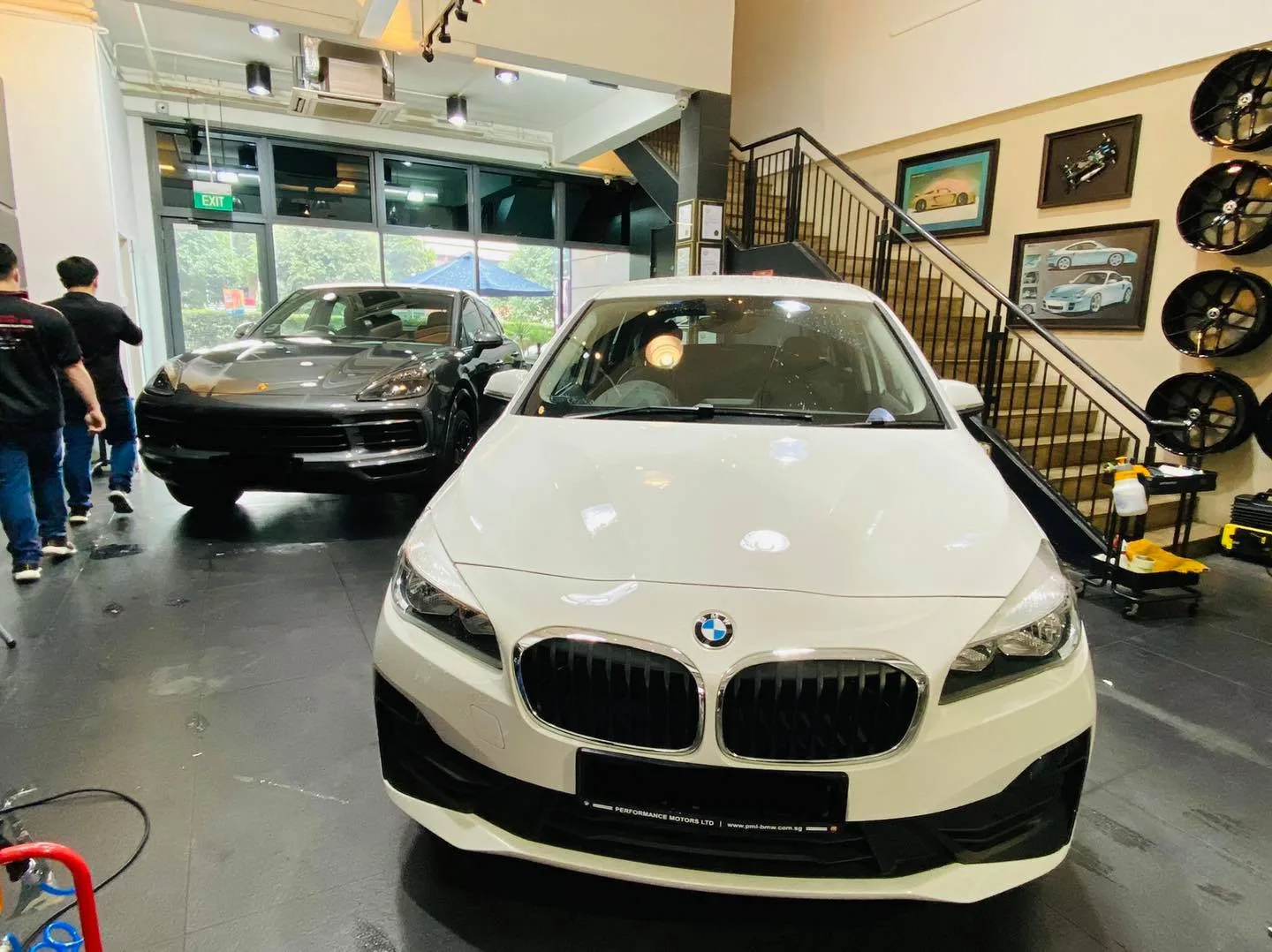 White BMW and grey BMW inside Infratint Singapore showroom
