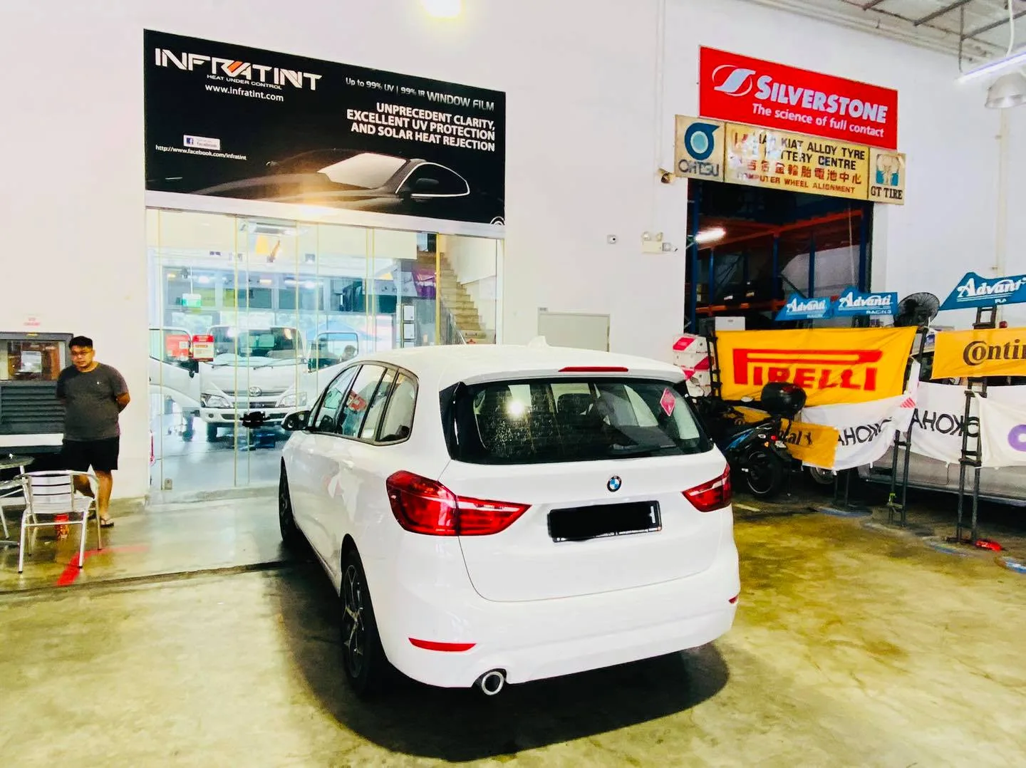 White BMW tourer at Infratint Singapore for window film installation