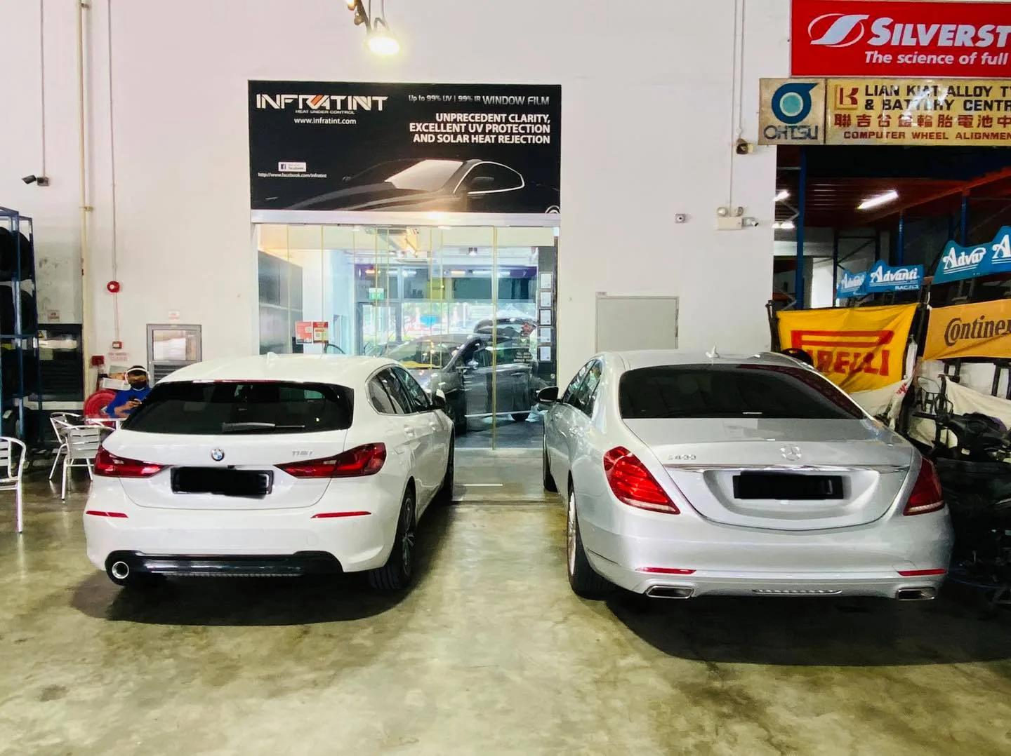 White BMW 1 Series and silver Mercedes-Benz S-Class at Infratint Singapore