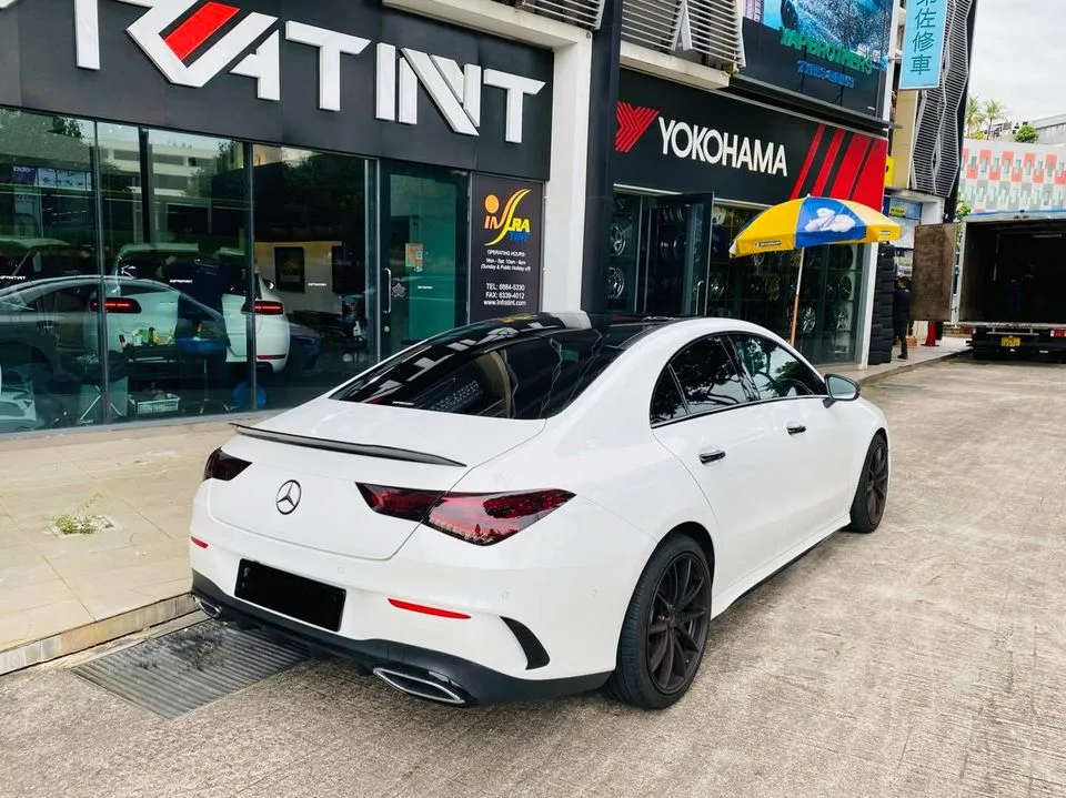 White Mercedes-Benz CLA rear three-quarter outside Infratint Singapore after window film