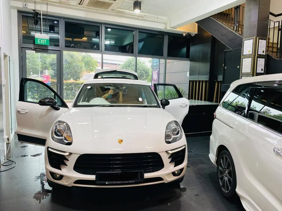 White Porsche Macan with doors open at Infratint Singapore for window tinting