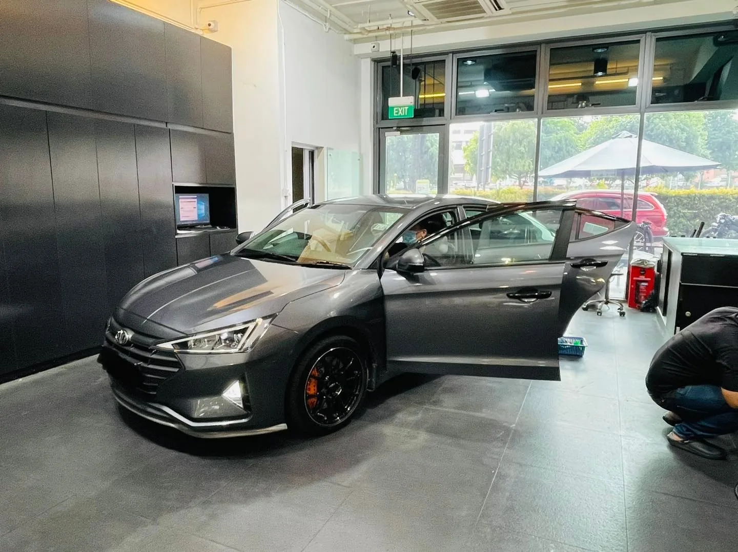 Grey Hyundai sedan with door open at Infratint Singapore for window tinting