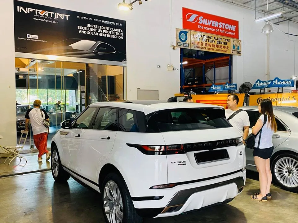 White Range Rover Evoque with customers nearby at Infratint Singapore