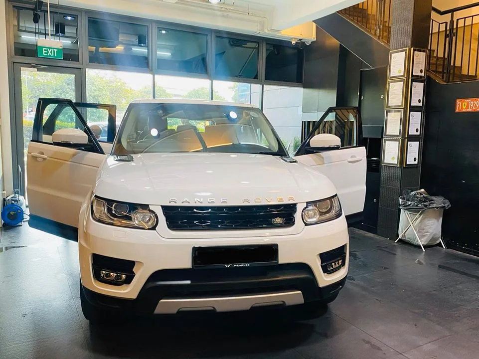 White Range Rover Sport with doors open before window tinting at Infratint Singapore
