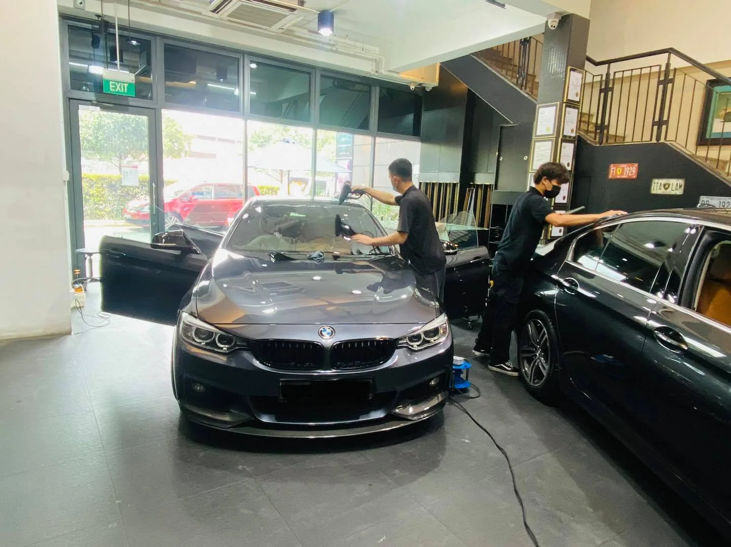 Grey BMW 4 Series coupe having its windscreen filmed at Infratint Singapore