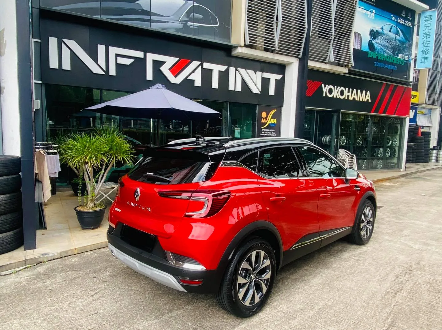 Red Renault Captur rear view outside Infratint Singapore