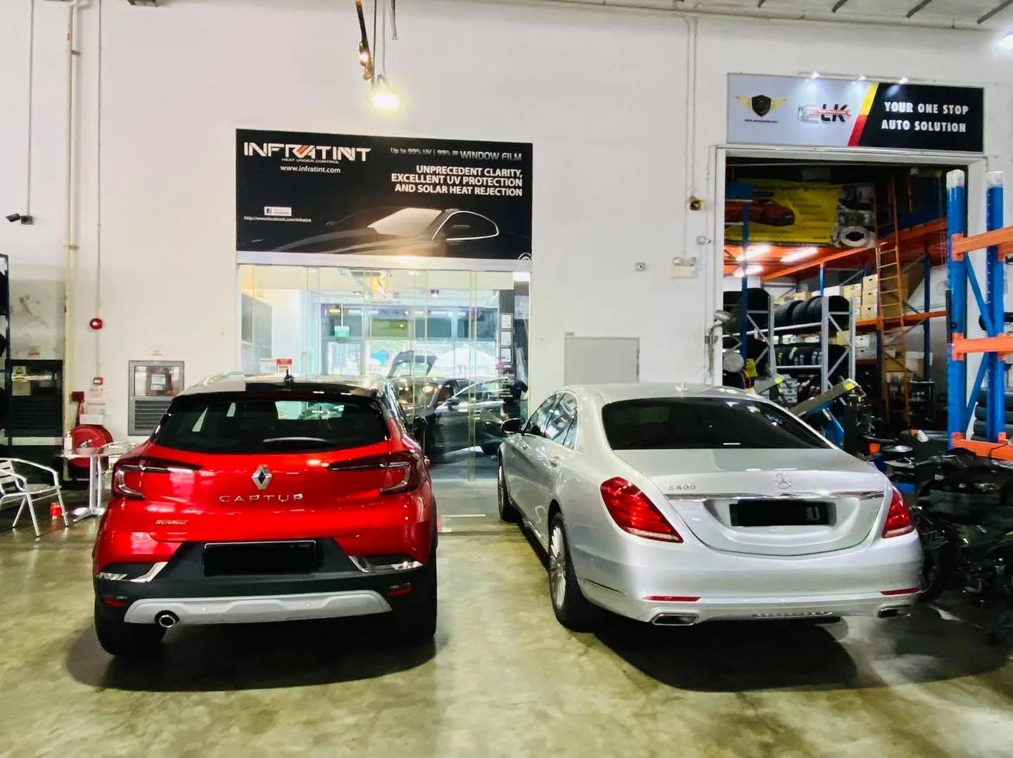 Red Renault Captur and silver Mercedes-Benz S-Class inside Infratint Singapore for window tinting