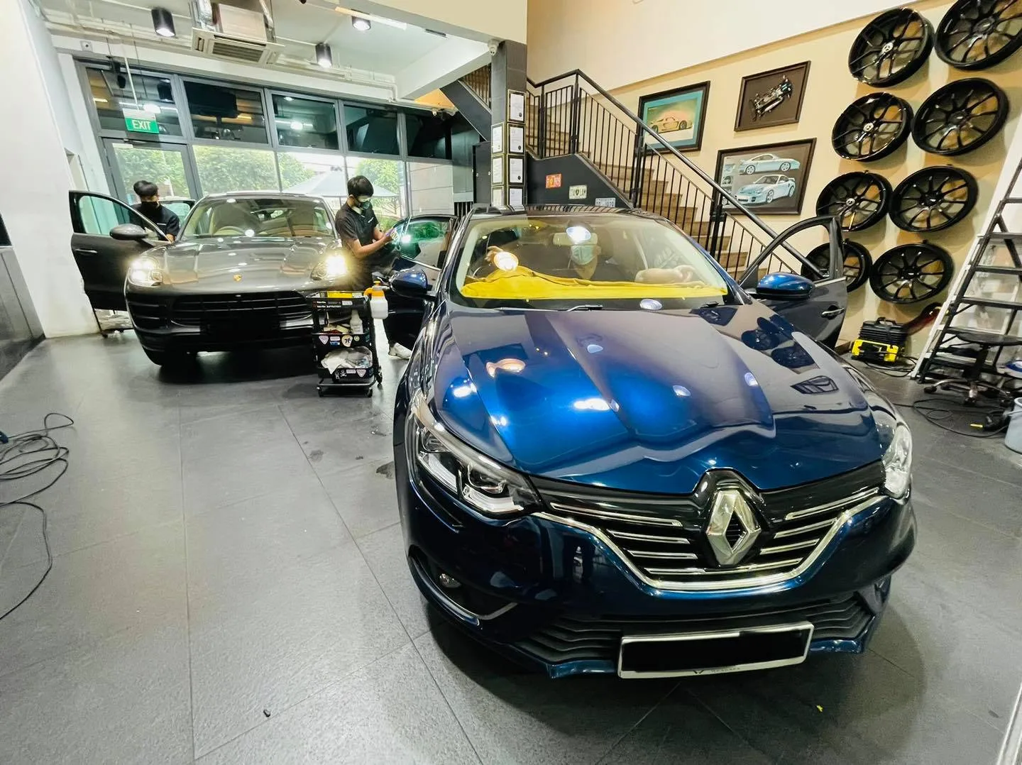 Blue Renault Megane with taped windows during a tint install at Infratint Singapore