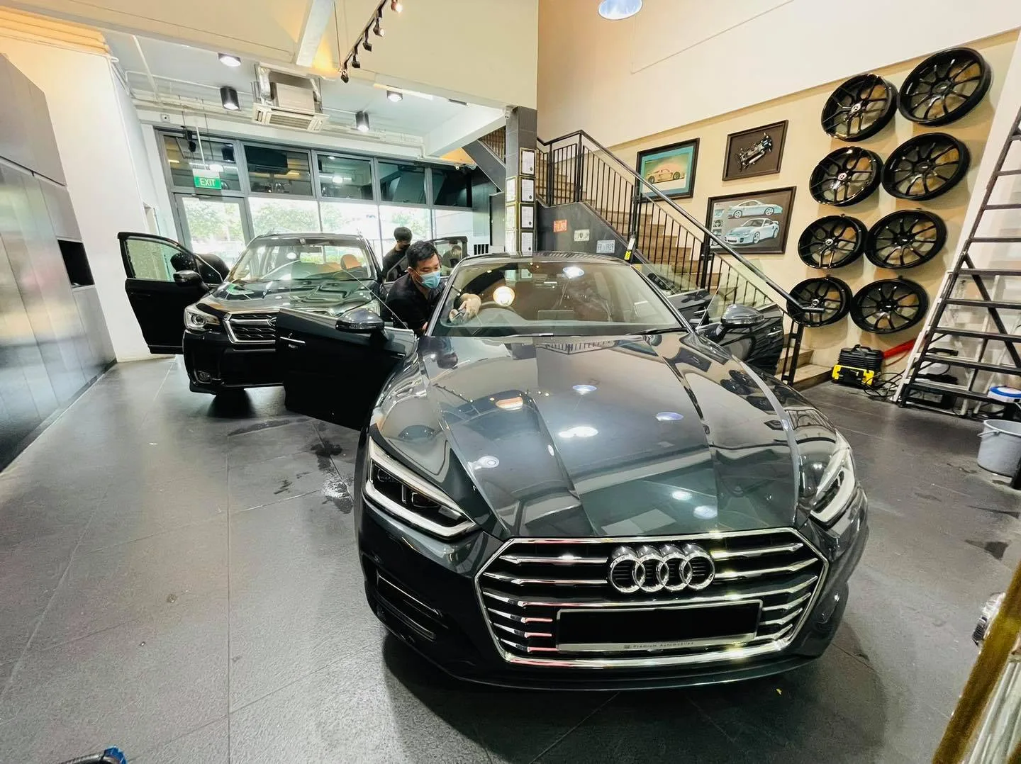 Dark grey Audi getting window tinting at Infratint Singapore showroom