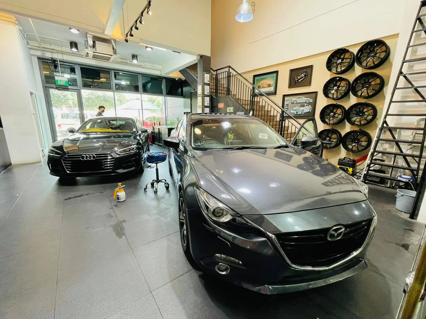 Grey Mazda 3 and Audi inside the Infratint Singapore install bay