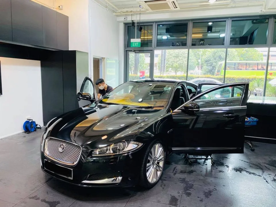 Black Jaguar sedan having window film fitted at Infratint Singapore