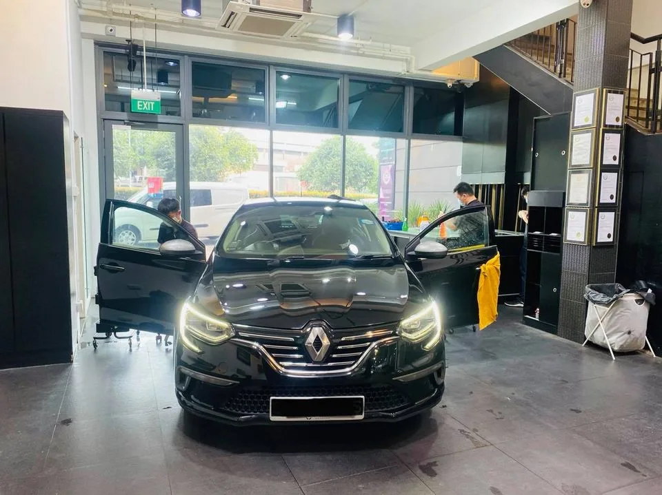 Black Renault Megane being prepped for window film at Infratint Singapore