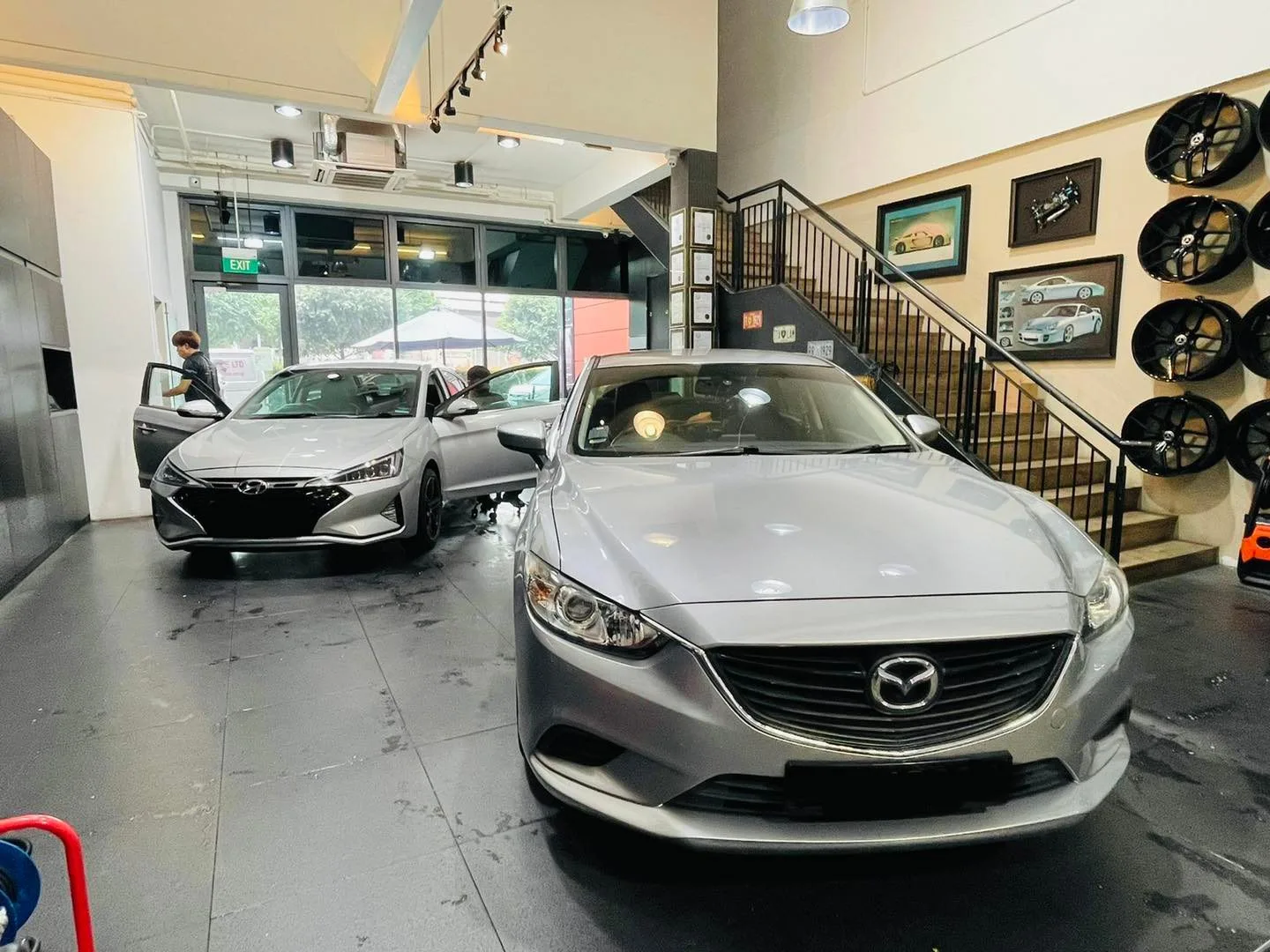 Silver Mazda 6 and grey Hyundai at Infratint Singapore for window tinting