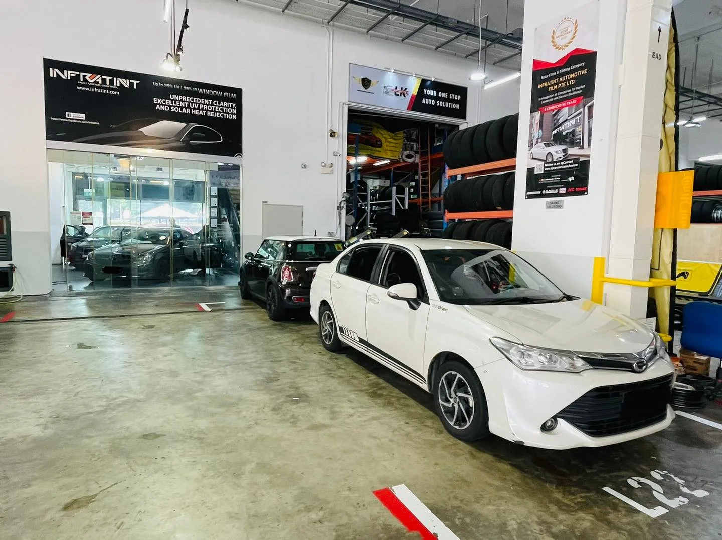 White Toyota Corolla Altis at Infratint Singapore awaiting window film