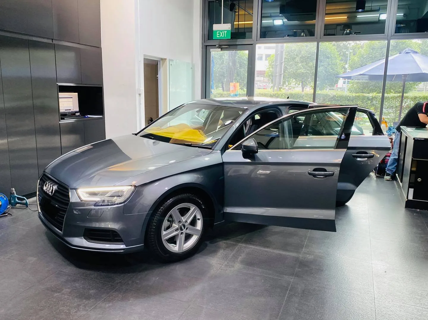 Grey Audi A3 sedan side view with doors open at Infratint Singapore