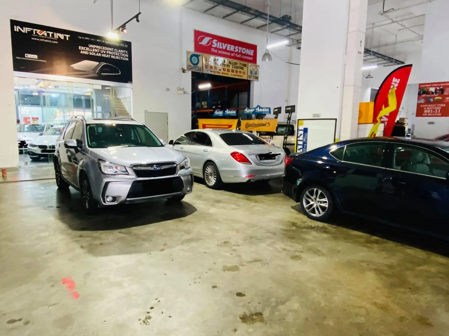 Silver Subaru Forester, Mercedes-Benz S-Class and blue sedan parked at Infratint Singapore