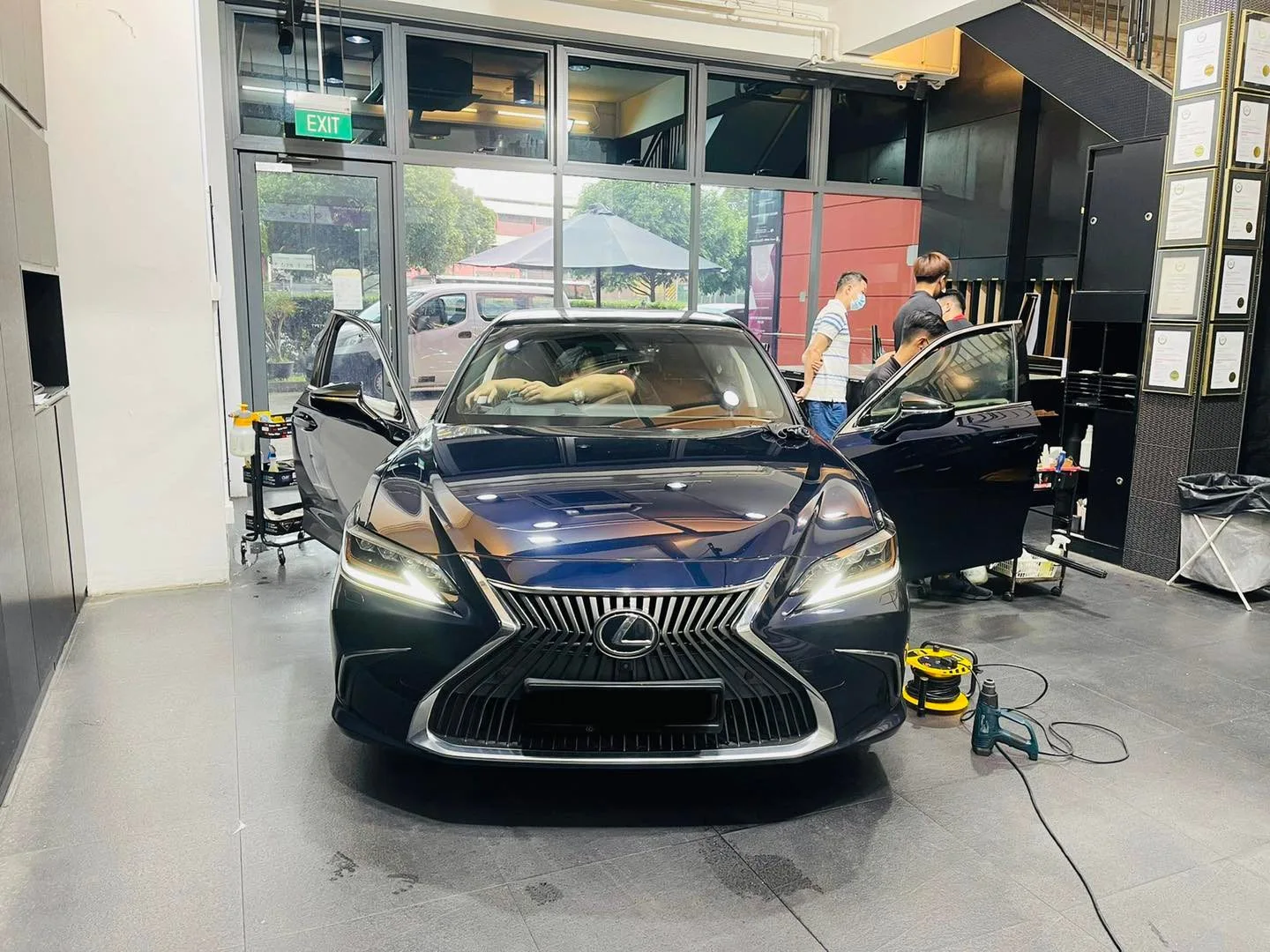 Dark blue Lexus sedan viewed head-on at Infratint Singapore for window film