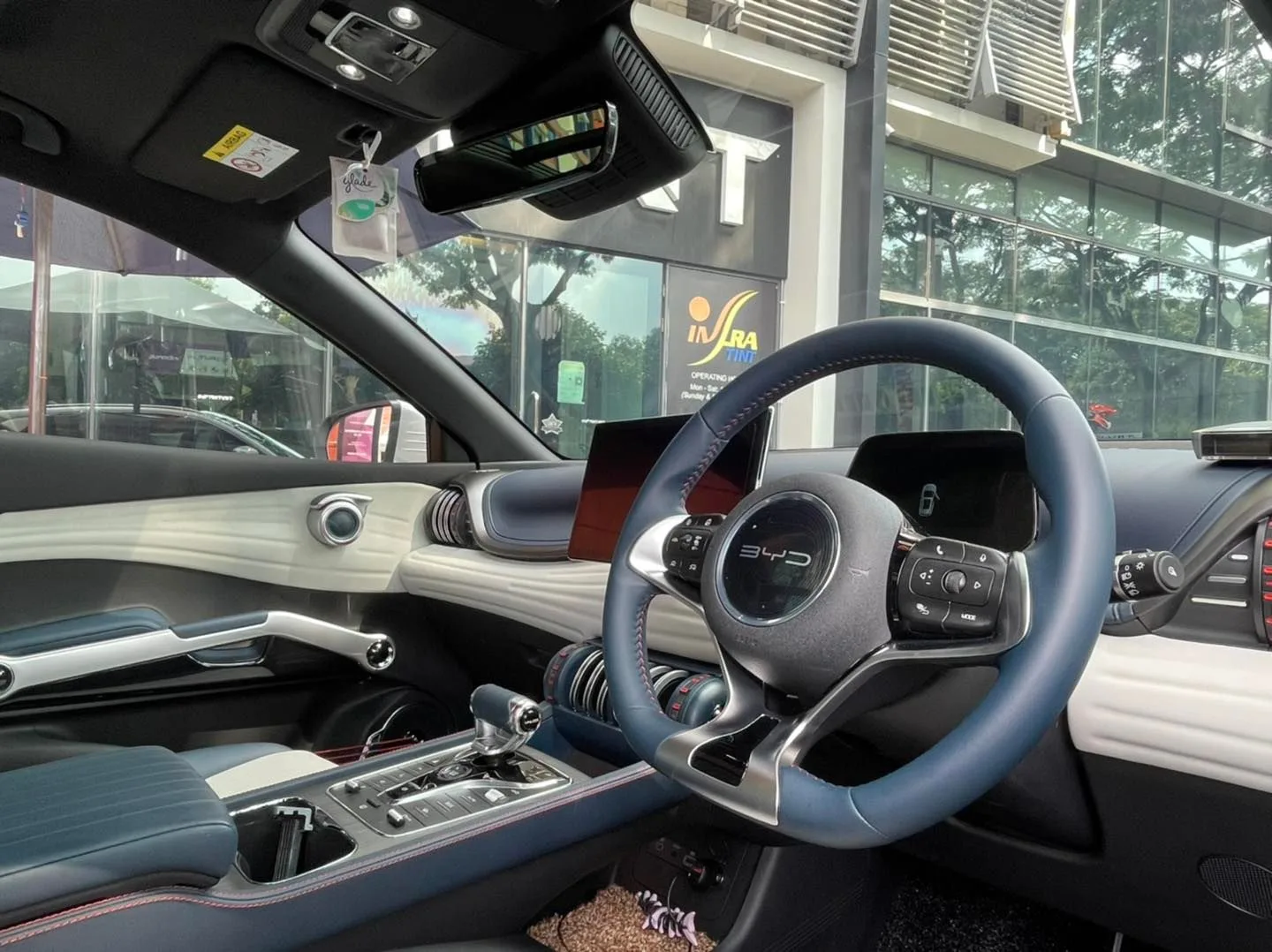 BYD Atto 3 interior with steering wheel and dashboard, tinted windows by Infratint Singapore