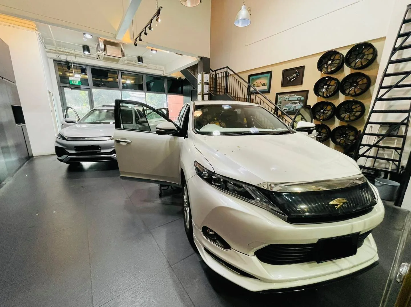 White Toyota Harrier SUV with doors open for window tinting at Infratint Singapore