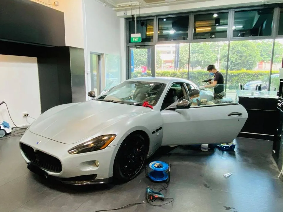 Silver Maserati GranTurismo coupe being tinted at Infratint Singapore