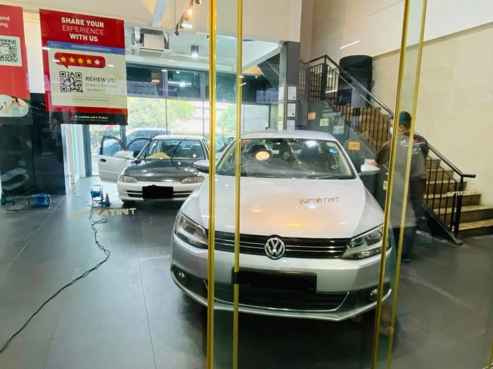 Silver Volkswagen sedan in the showroom at Infratint Singapore for window tinting