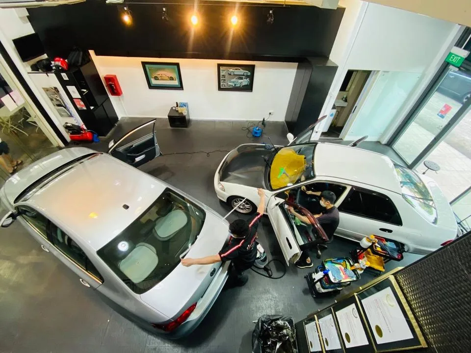 Overhead view of two cars being tinted side by side at Infratint Singapore