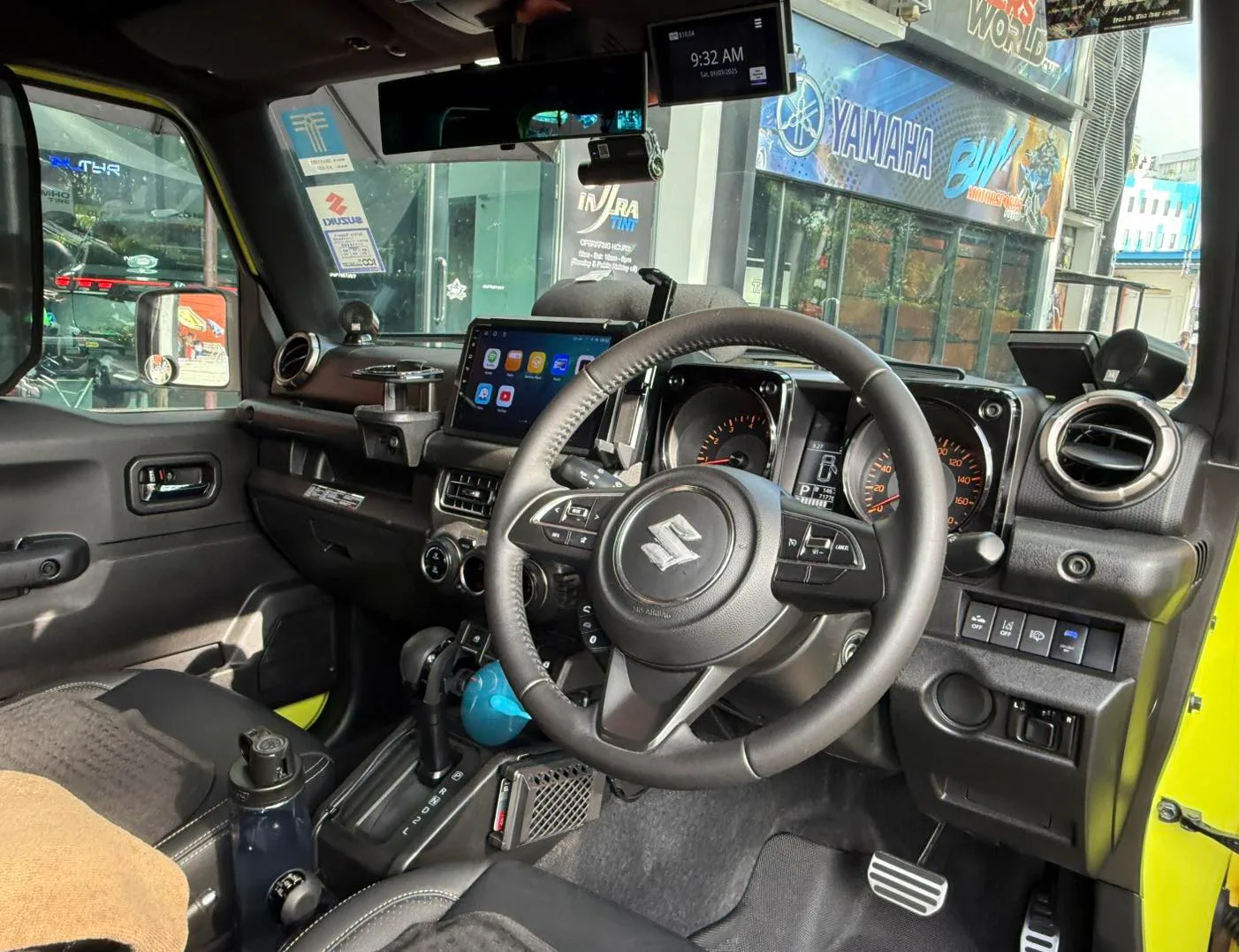 Suzuki Jimny cockpit and touchscreen seen through tinted glass at Infratint Singapore
