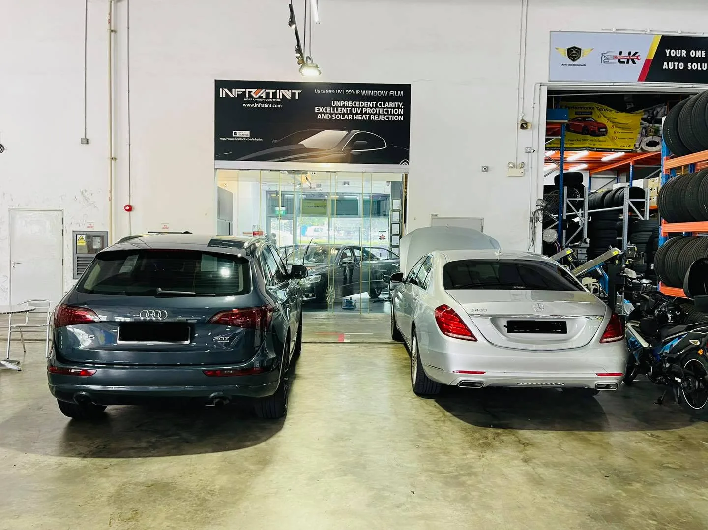 Dark Audi Q5 and silver Mercedes-Benz S-Class at Infratint Singapore for window tinting