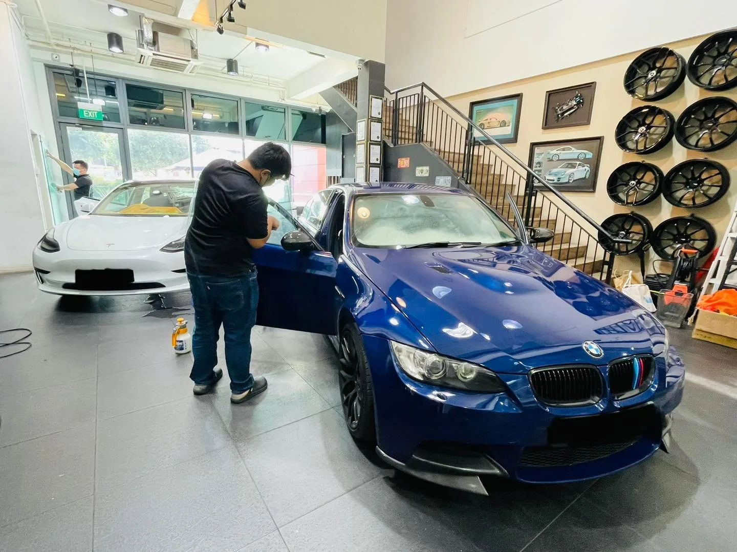 Blue BMW M3 coupe being window tinted at Infratint Singapore