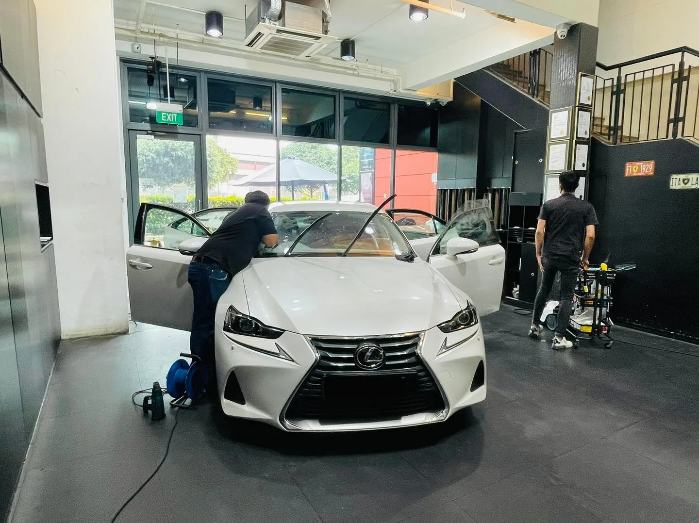White Lexus IS sedan having window film fitted at Infratint Singapore