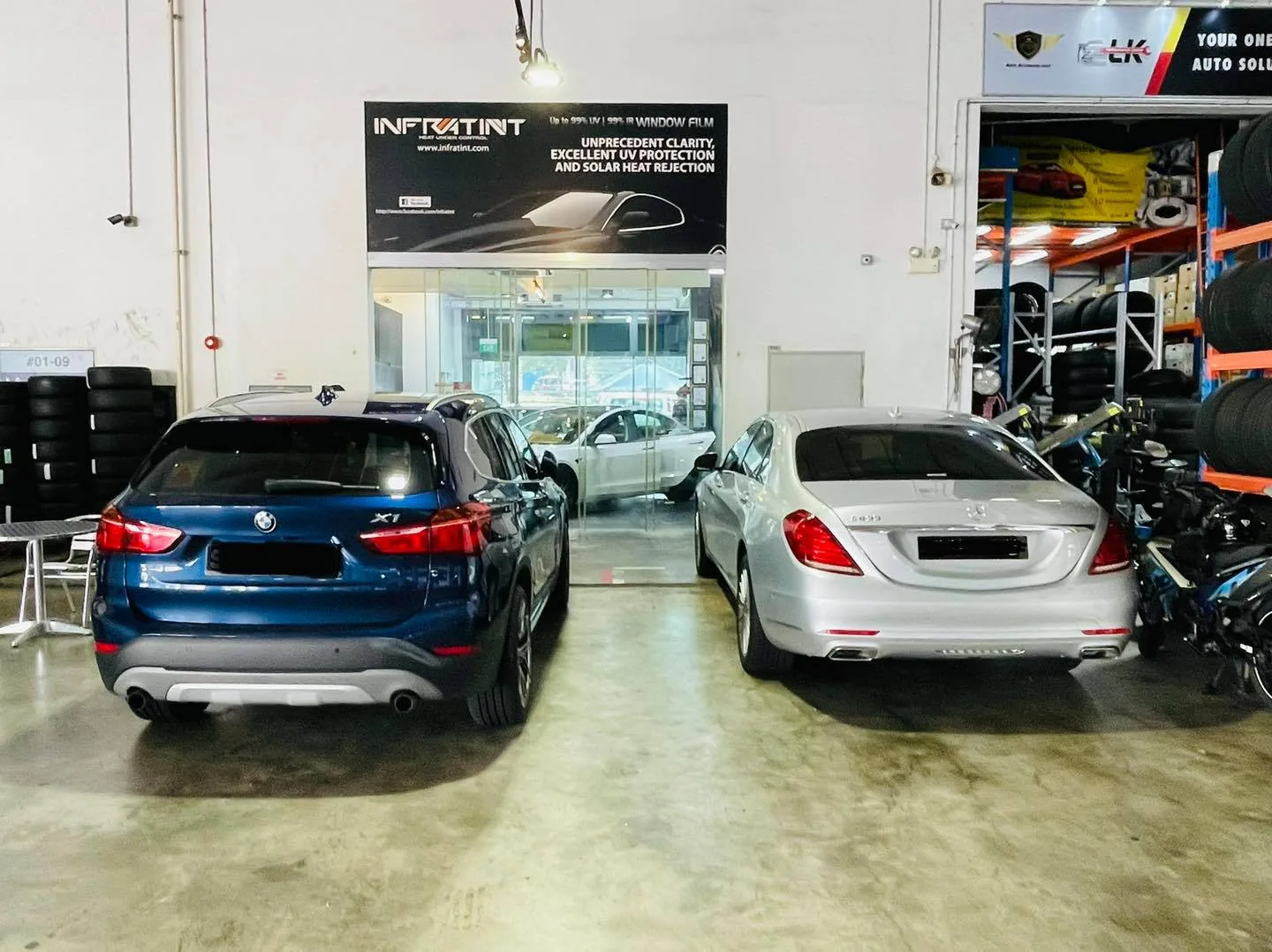 Blue BMW X1 and silver Mercedes-Benz S-Class at Infratint Singapore for window film