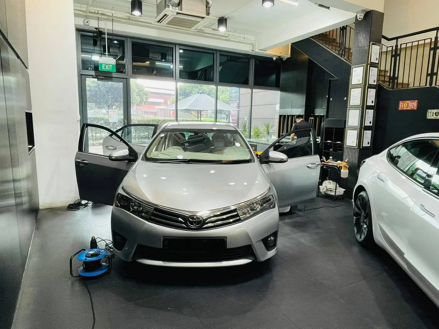 Silver Toyota Corolla Altis getting ready for window film at Infratint Singapore