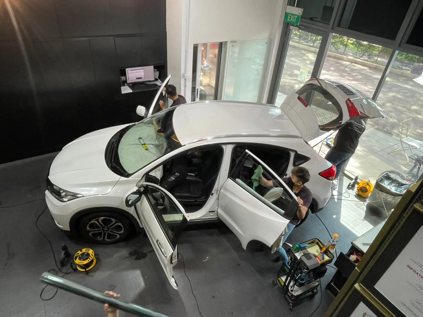 Overhead view of a white Honda HR-V being tinted by the team at Infratint Singapore