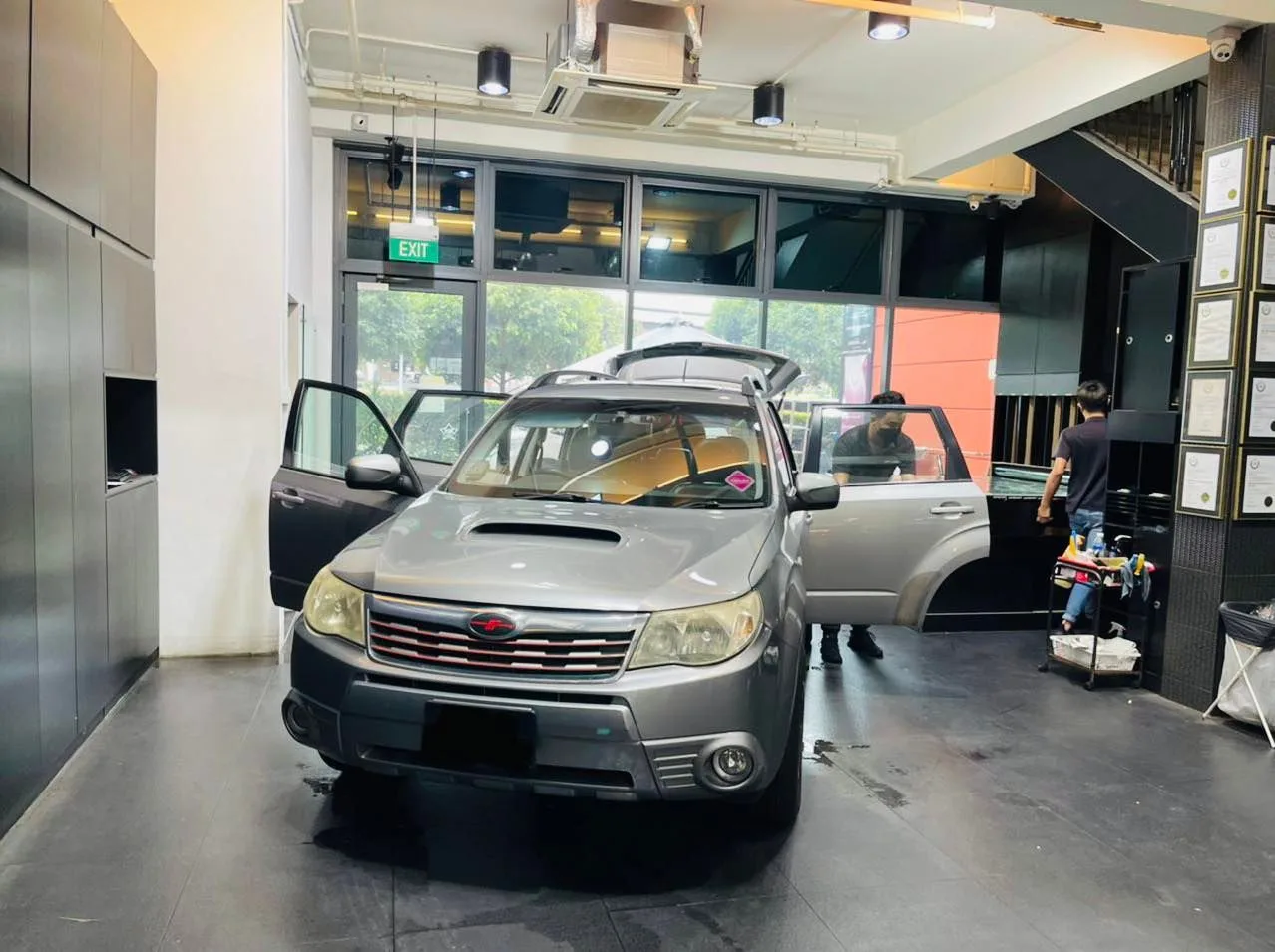 Silver Subaru Forester with doors open for window film installation at Infratint Singapore