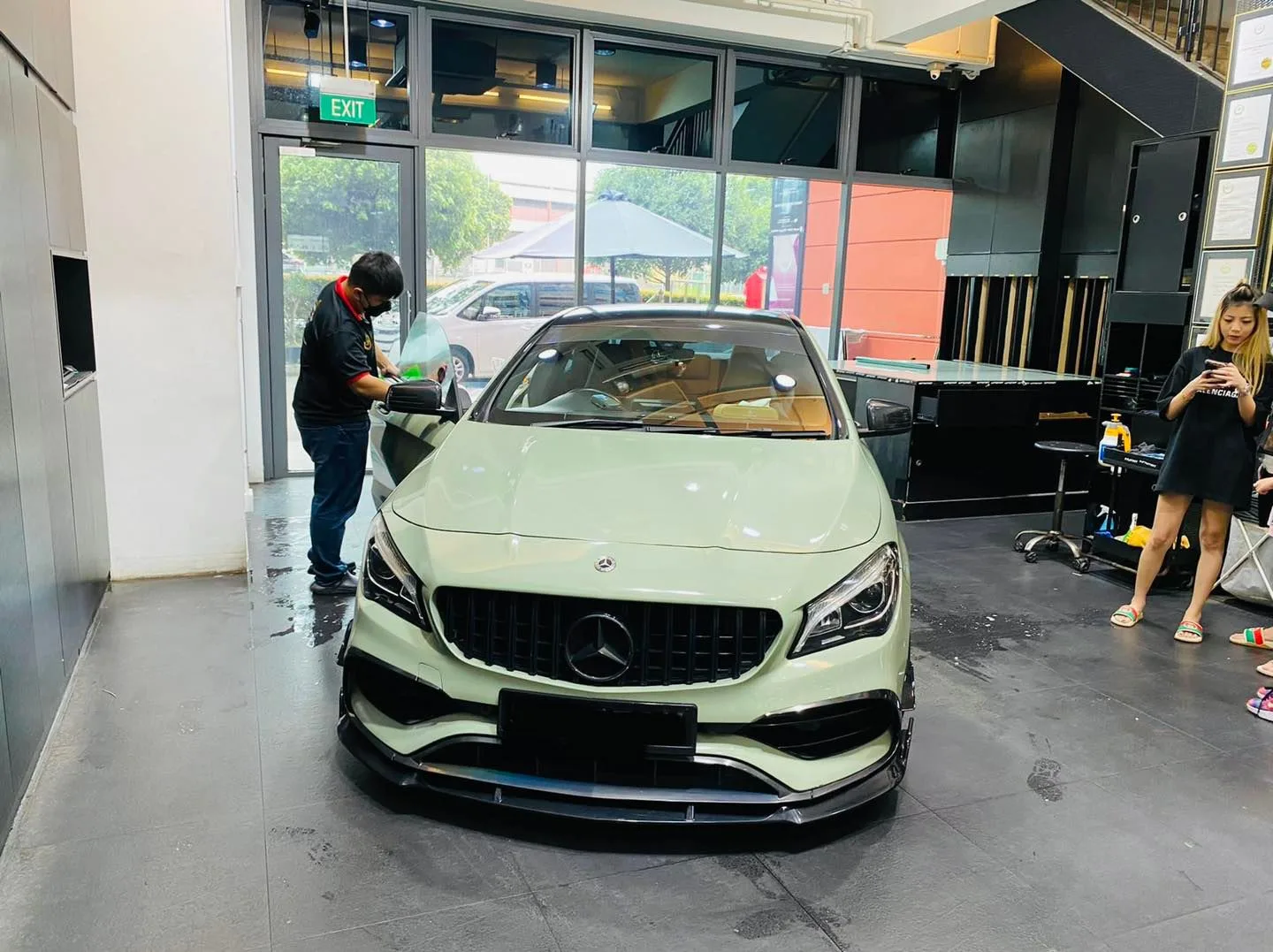 Pale green Mercedes-Benz CLA being prepared for window film at Infratint Singapore