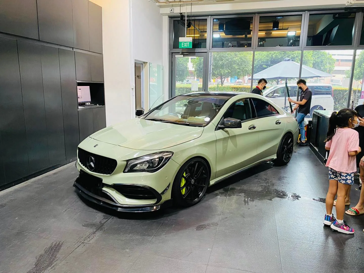 Pale green Mercedes-Benz CLA with yellow calipers at Infratint Singapore for window tinting