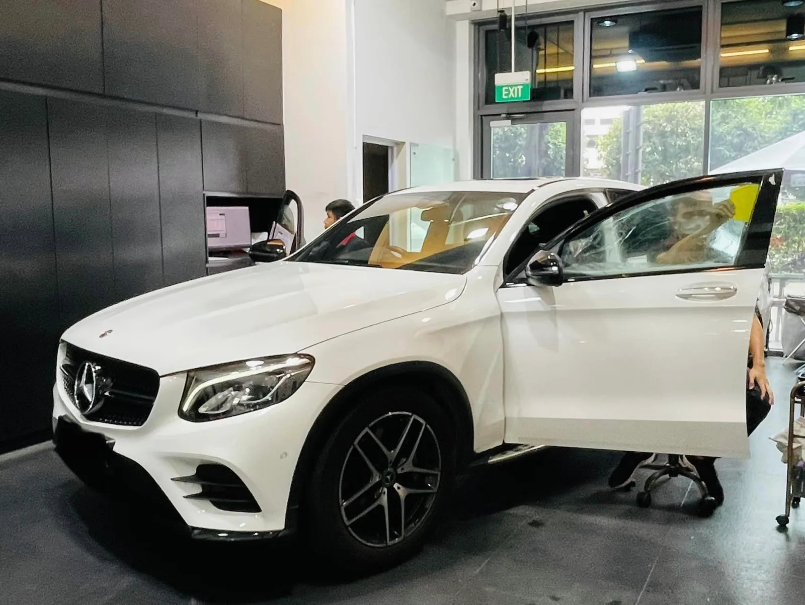 Side view of a white Mercedes-Benz GLC during tinting at Infratint Singapore