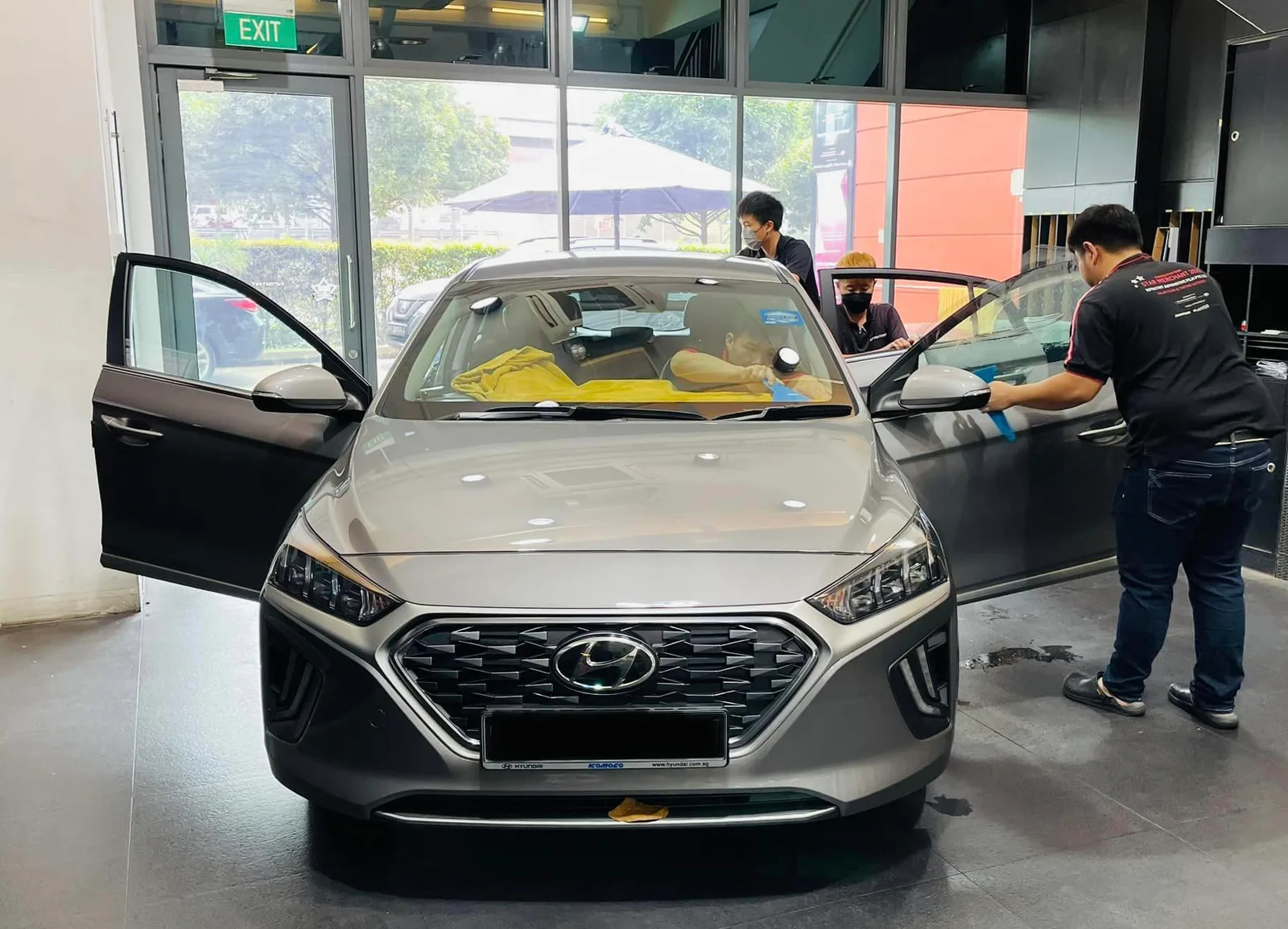 Silver Hyundai Ioniq having window film fitted at Infratint Singapore