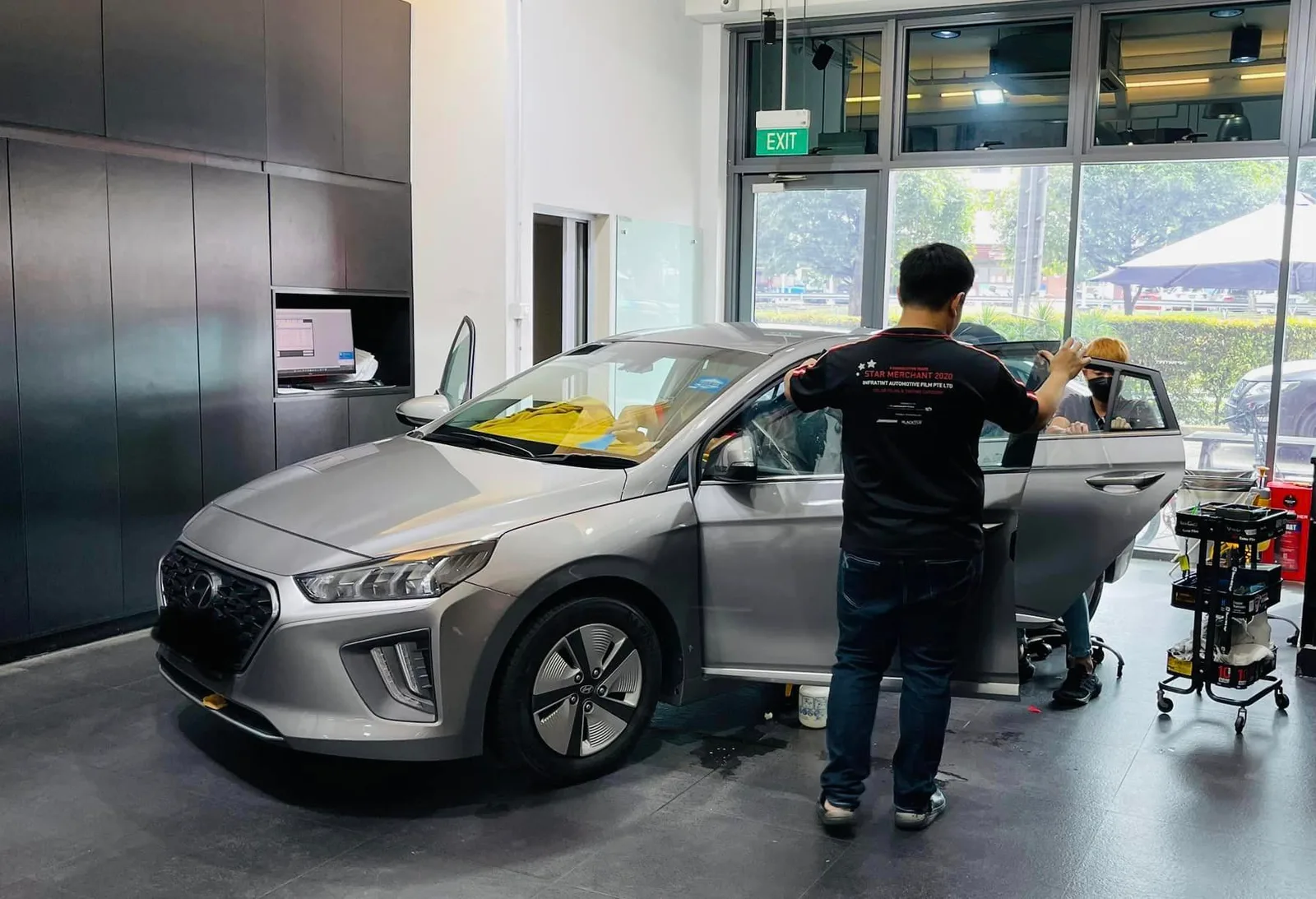Silver Hyundai Ioniq side window being tinted at Infratint Singapore