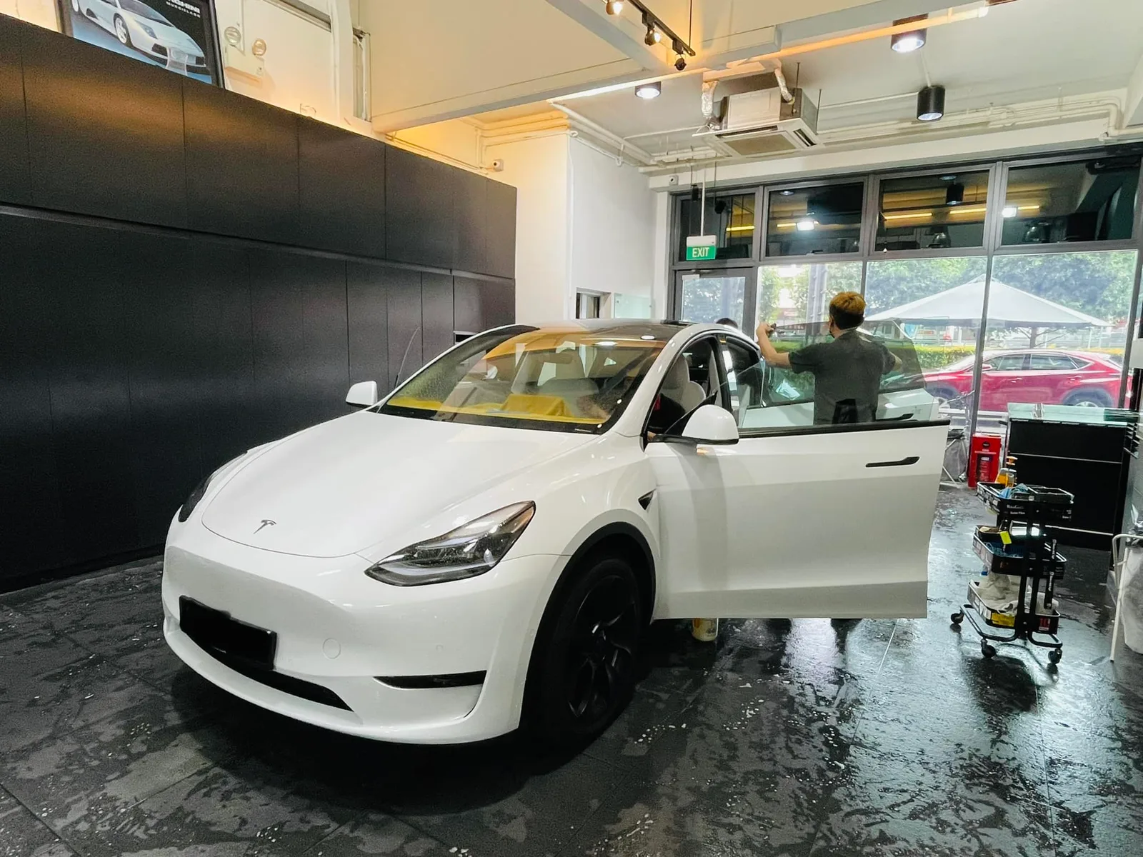 White Tesla Model Y getting window film fitted at Infratint Singapore