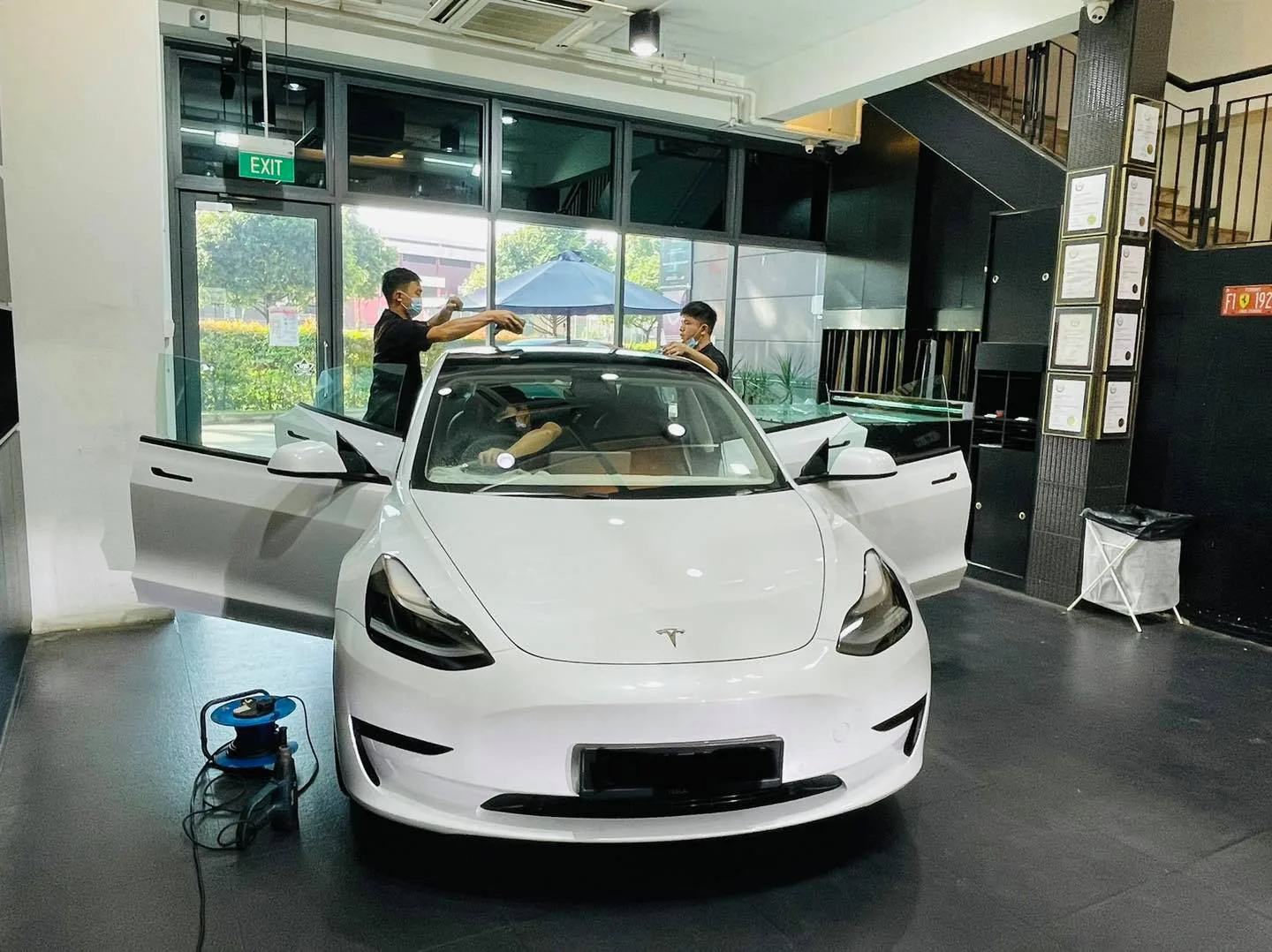 White Tesla Model 3 during window film install at Infratint Singapore