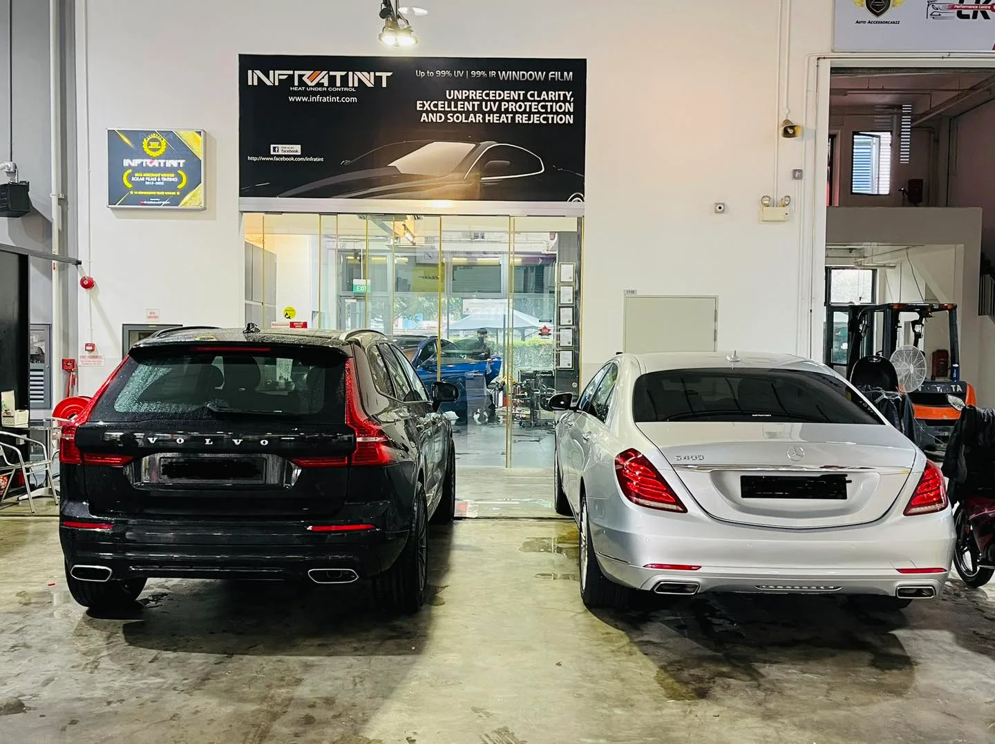 Black Volvo wagon and silver Mercedes-Benz S-Class at Infratint Singapore