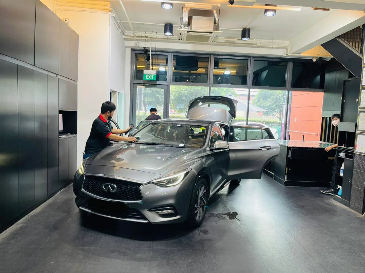 Grey Infiniti Q30 during window tinting at Infratint Singapore