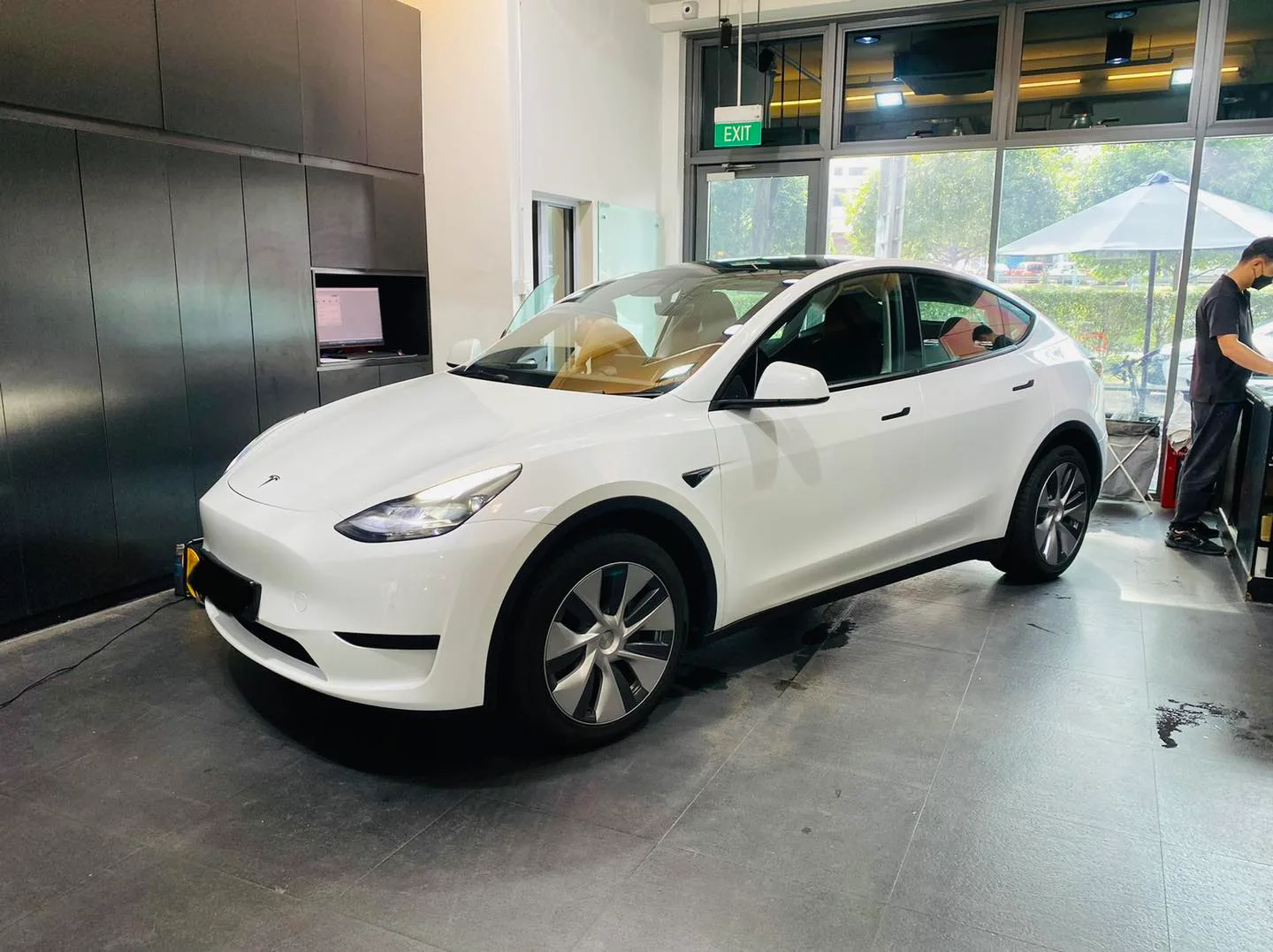 White Tesla Model Y front three-quarter at Infratint Singapore for window tinting
