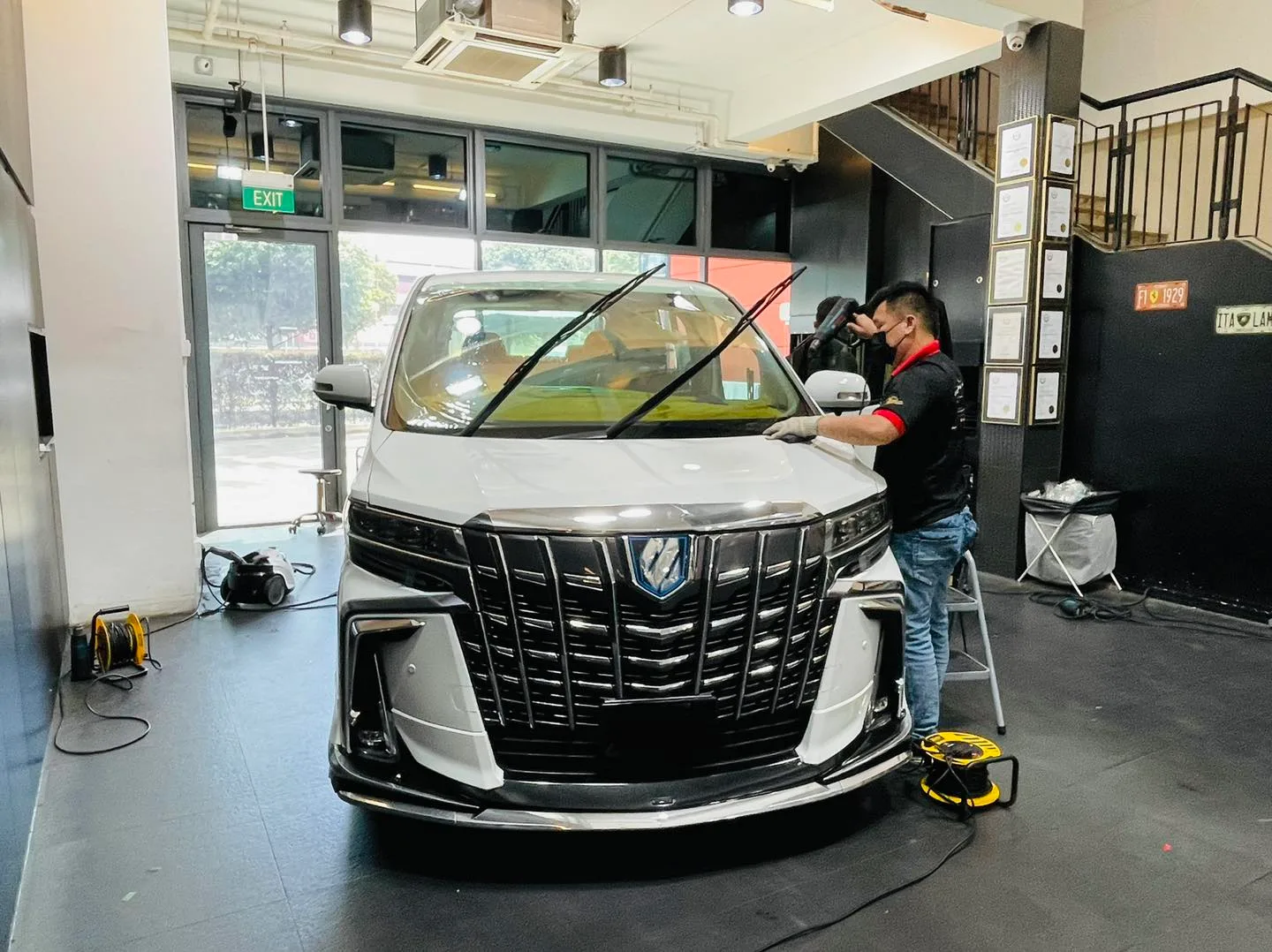 White Toyota Alphard having its windscreen tinted at Infratint Singapore