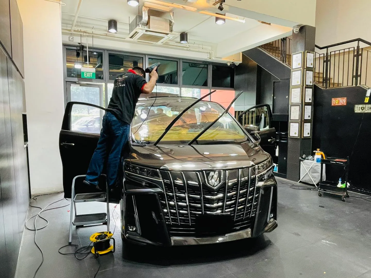 Dark Toyota Alphard having windscreen film fitted at Infratint Singapore