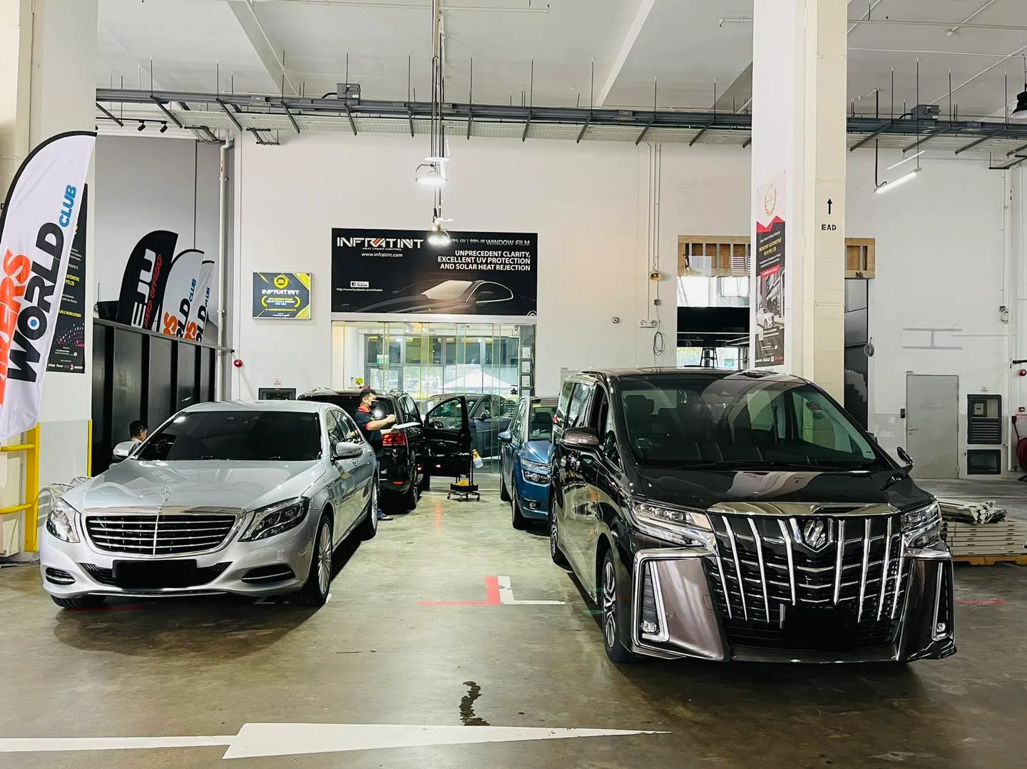 Silver Mercedes-Benz sedan and black Toyota Alphard at Infratint Singapore