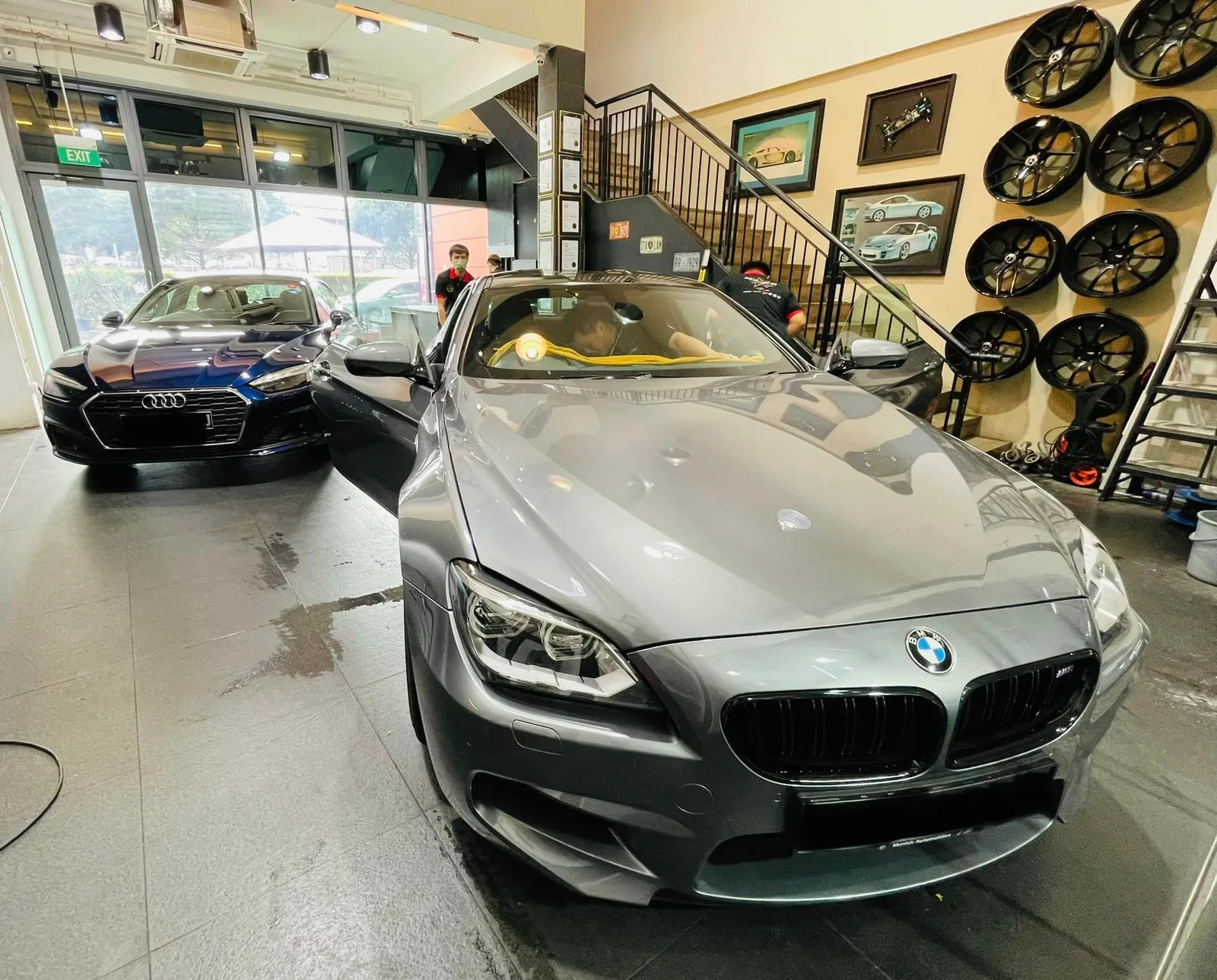 Grey BMW M6 and blue Audi being tinted at Infratint Singapore